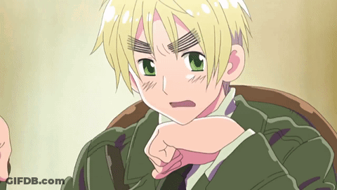 Cartoon Character With Blonde Hair And Green Eyes Sitting In Chair GIF