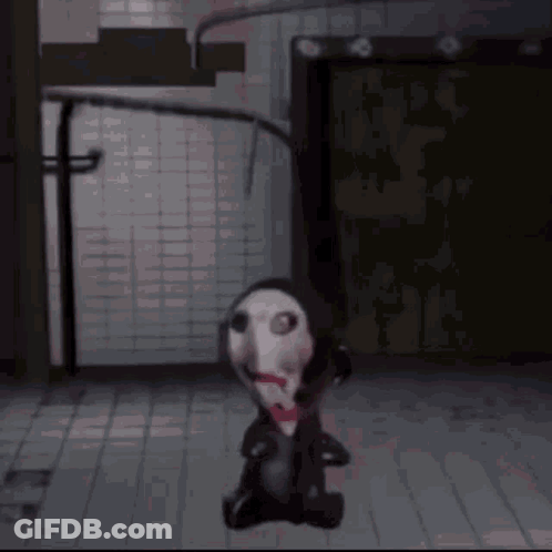 Cartoon Character With Bloody Face Sitting In Dark Room GIF