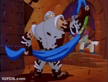 Cartoon Character With Blue Scarf Standing Next To Brick Wall GIF