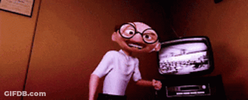Cartoon Character With Glasses In Front Of TV GIF