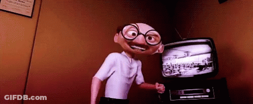 Cartoon Character With Glasses Standing In Front Of TV GIF