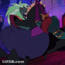 Cartoon Character With Green Hair Next To Large Wheel GIF
