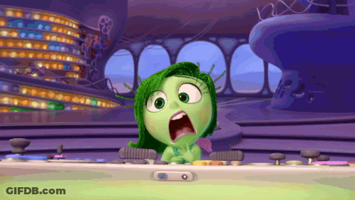 Cartoon Character With Green Hair Sitting At Desk Mouth Open GIF