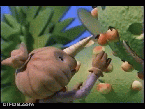 Cartoon Character With Horn Picking Apples From Tree GIF