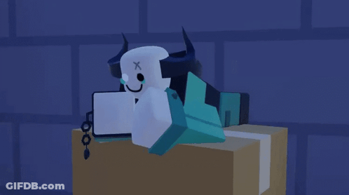 Cartoon Character With Horns And X On Head Laying On Box GIF