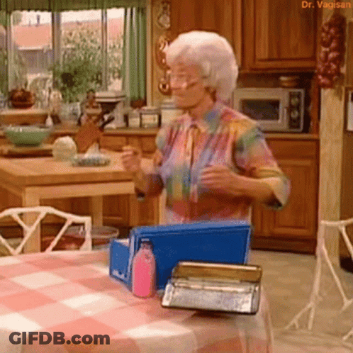 Cartoon Character With Pink Eyes Holding Sandwich GIF