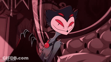 Cartoon Character With Red Eyes And Bow Tie Sitting On Couch GIF
