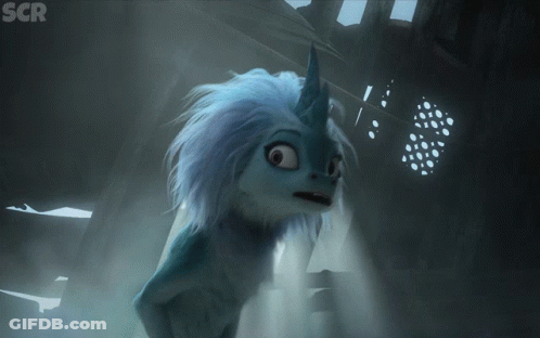 Cartoon Character With Unicorn Horn In Dark Room GIF