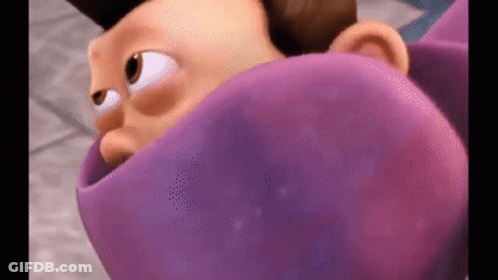 Cartoon Character Wrapped In Purple Cloth GIF