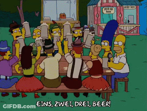 Cartoon Characters Sitting At Picnic Table With Pick Up Here Sign GIF