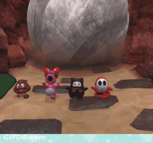 Cartoon Characters Standing Around Large Rock GIF