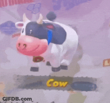 Cartoon Cow With Blue Collar And Sign Saying Cow GIF