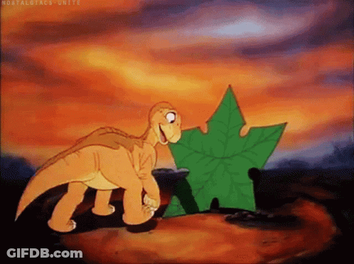 Cartoon Dinosaur Standing Next To Leaf GIF