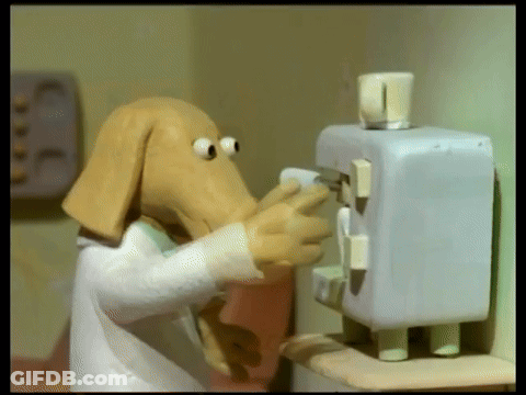 Cartoon Dog Head Standing Next To Machine GIF
