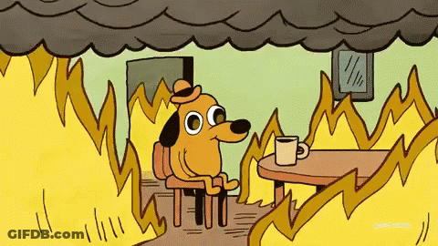 Cartoon Dog Sitting At Table With Coffee And Flames GIF