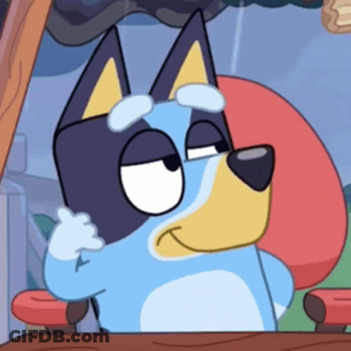 Cartoon Dog Sitting At Table With Red Pillow GIF