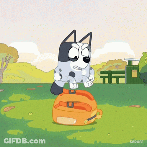 Cartoon Dog Standing On Orange Suitcase GIF