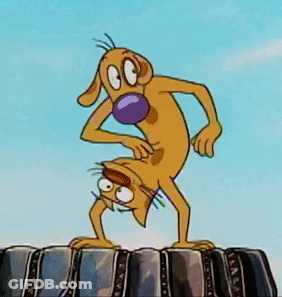 Cartoon Dog With Purple Nose Standing On Rock GIF