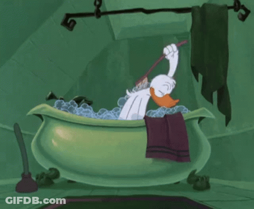 Cartoon Duck Bathing In Green Bathtub Holding Toothbrush GIF