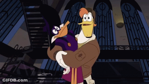 Cartoon Duck Holding Duck With Letter T GIF