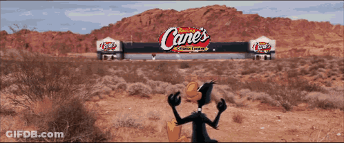 Cartoon Duck In Front Of Canes Sign GIF