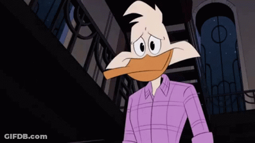 Cartoon Duck In Purple Shirt Standing In Front Of Building GIF