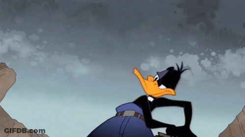 Cartoon Duck Standing On Rocky Cliff GIF