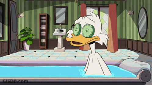 Cartoon Duck With Cucumber Slices Taking A Bath GIF