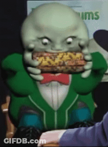Cartoon Eating Sandwich With Tums Sign GIF