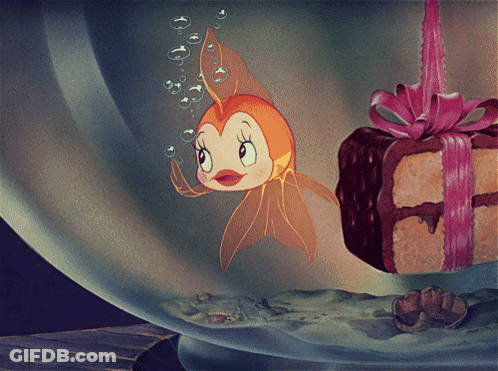 Cartoon Fish Swimming Beside Cake With Bow GIF