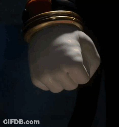 Cartoon Fist In Front Of Building GIF