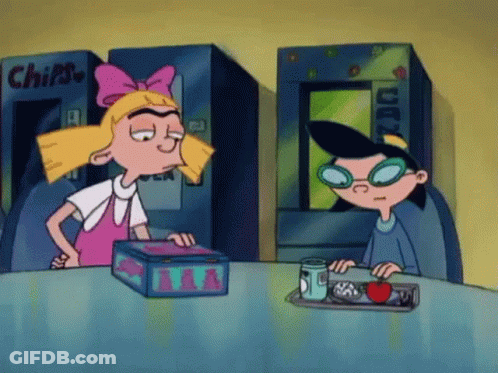 Cartoon Girl And Boy Sitting At Table GIF