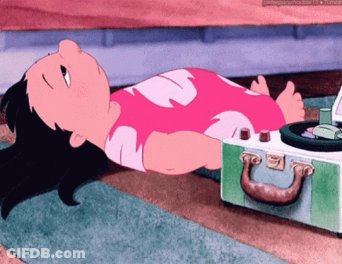 Cartoon Girl Laying Next To Suitcase GIF