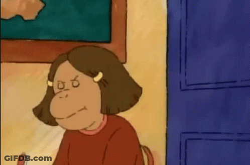 Cartoon Girl With Monkey Face Sitting At Table GIF