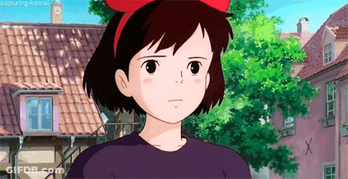 Cartoon Girl With Red Bow Standing In Front Of Building GIF