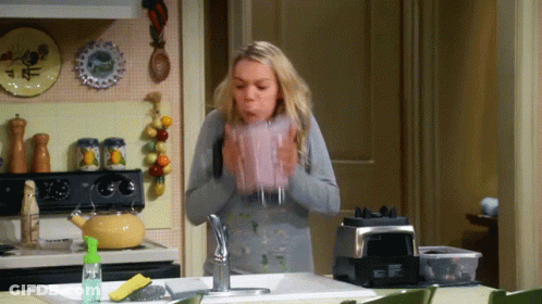 Cartoon Hand Holding Purple Object GIF