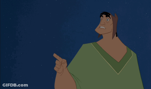 Cartoon In Green Shirt Pointing Up GIF