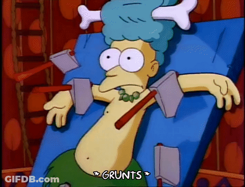 Cartoon Laying On Bed With Bone On Head Grunts GIF