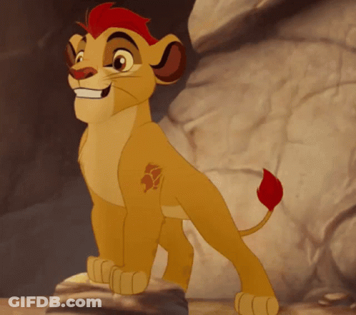 Cartoon Lion Cub With Red Mane Standing On Rock GIF