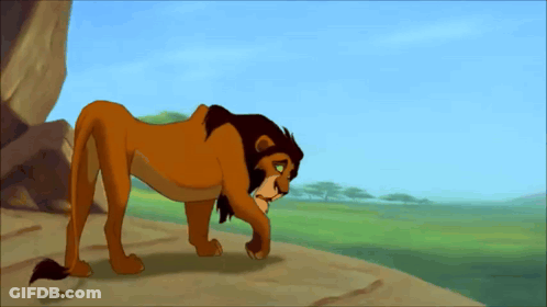 Cartoon Lion Standing On Rocky Hillside GIF