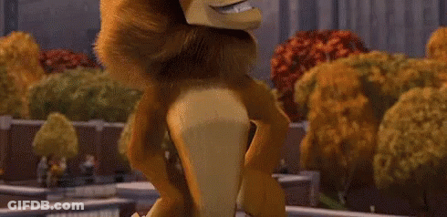 Cartoon Lion With Long Mane Standing In Park GIF