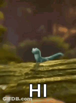 Cartoon Lizard Standing On Rock Waving GIF