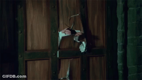 Cartoon Man Breaking Through Door GIF