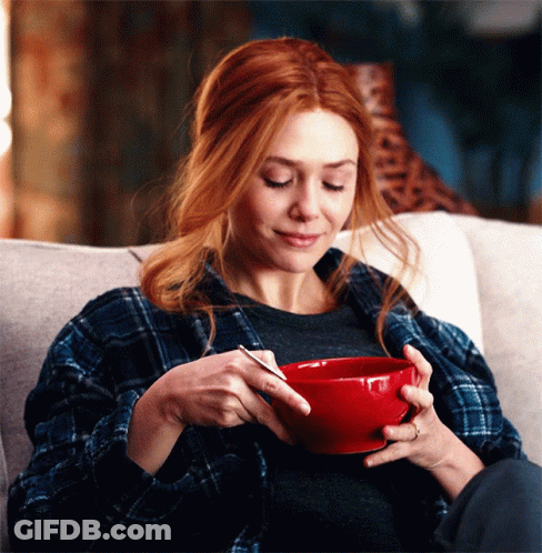 Cartoon Man Eating Cereal With Cereal Pile GIF