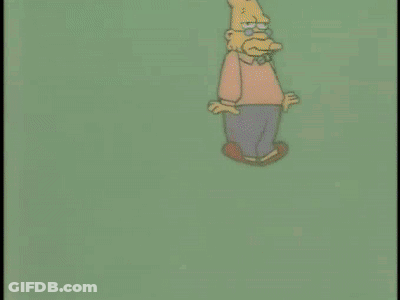 Cartoon Man Next To Pink Box With Heart GIF