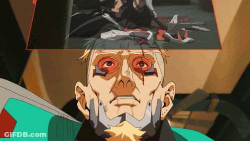Cartoon Man With Red Eyes And Green Shirt GIF