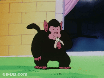 Cartoon Monkey Eating Banana In Grass GIF