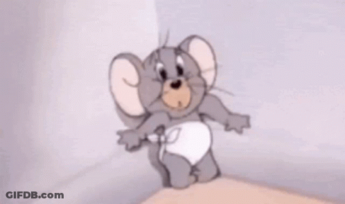 Cartoon Mouse In Diaper Standing On Table GIF