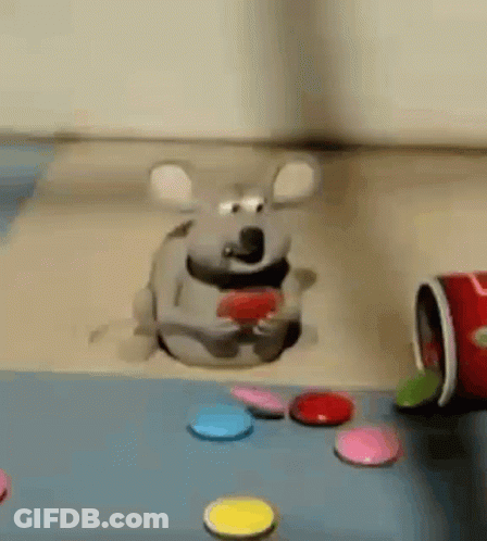 Cartoon Mouse Sitting In Hole Eating Red Heart GIF