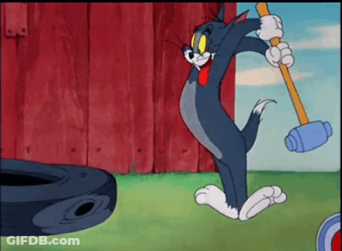 Cartoon Mouse Sitting On Bed Nibbles GIF